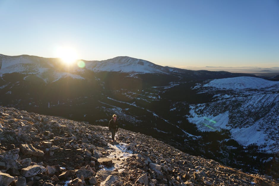 alpine sunrise contemplative person on rock