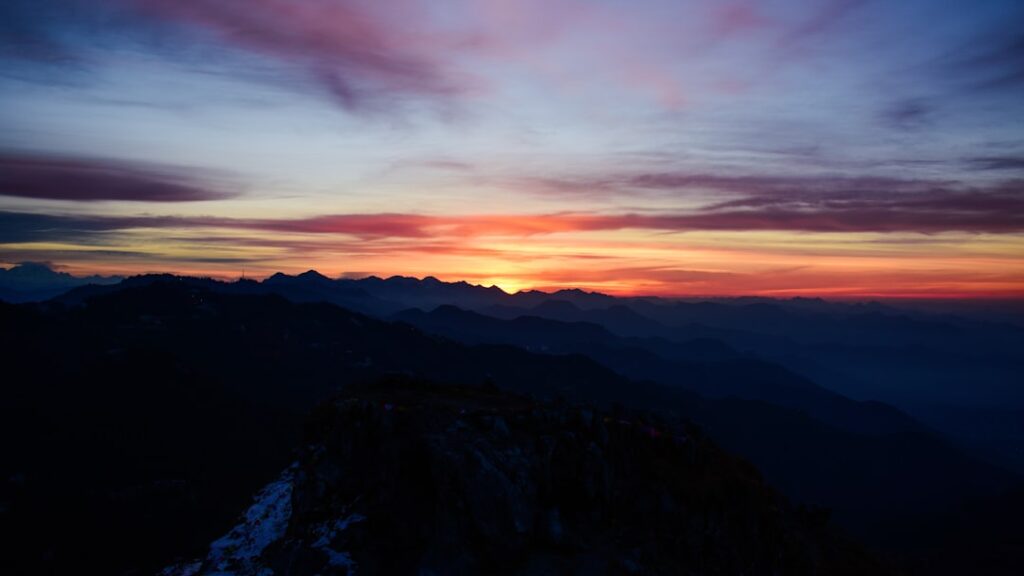 Sunset over Dolomites mountain ridge