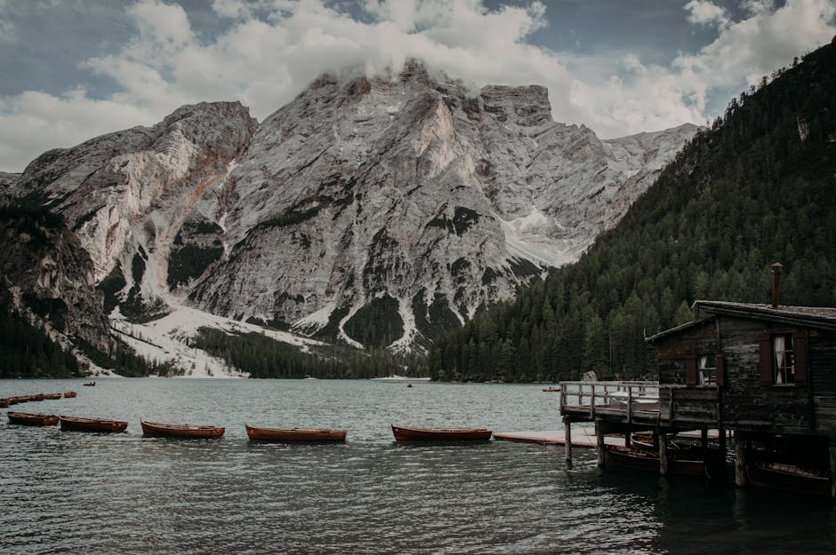 Wooden pier Lago di Braies reflection