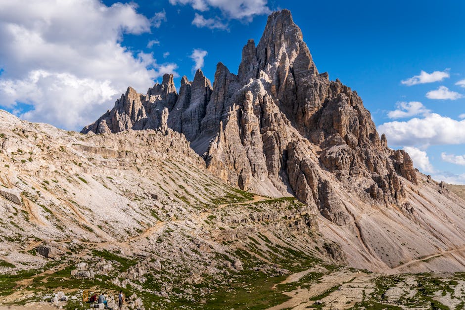 Alpine hikers near Tre Cime rock faces