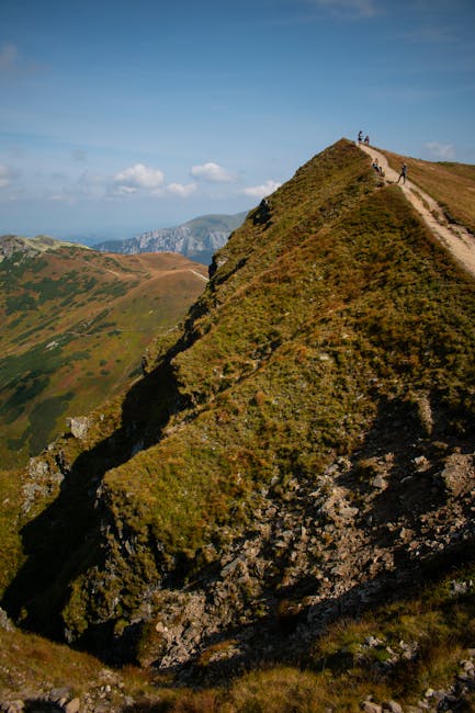 Alpine rocky ridge hikers ascending